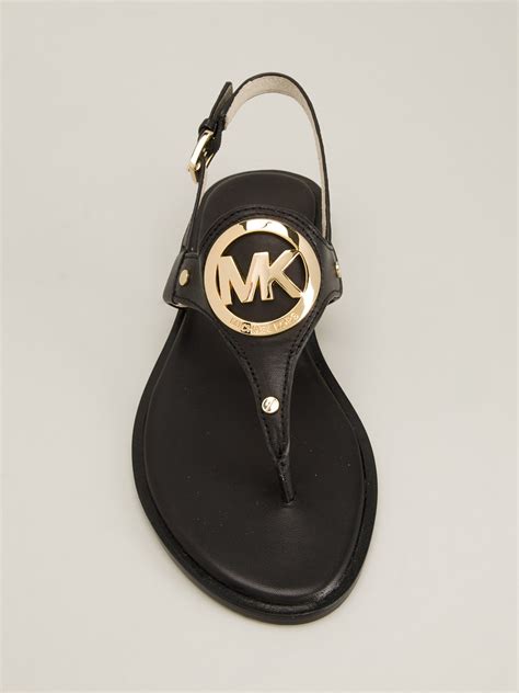 michael kors black flat sandals.